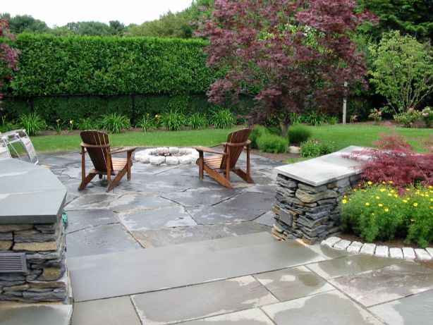 Beautiful patio with stonework and landscape grading design